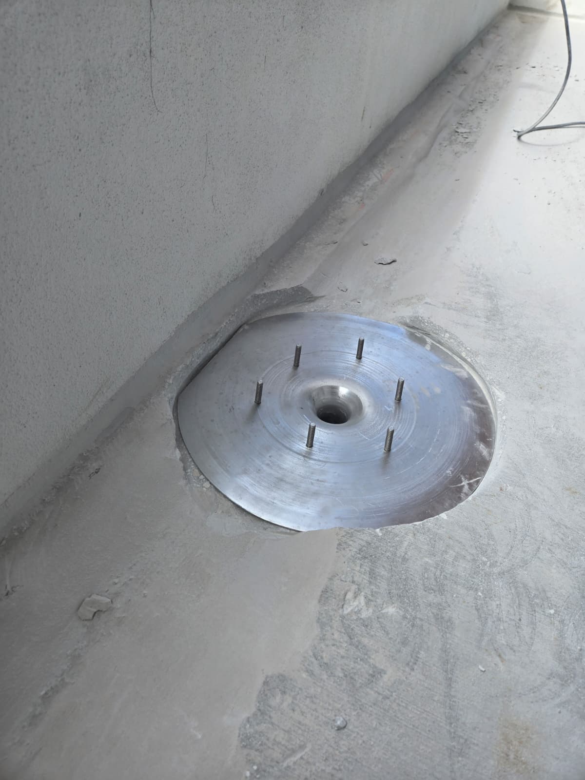Authentic structural concrete slab cutout and stainless steel drain clamping ring install