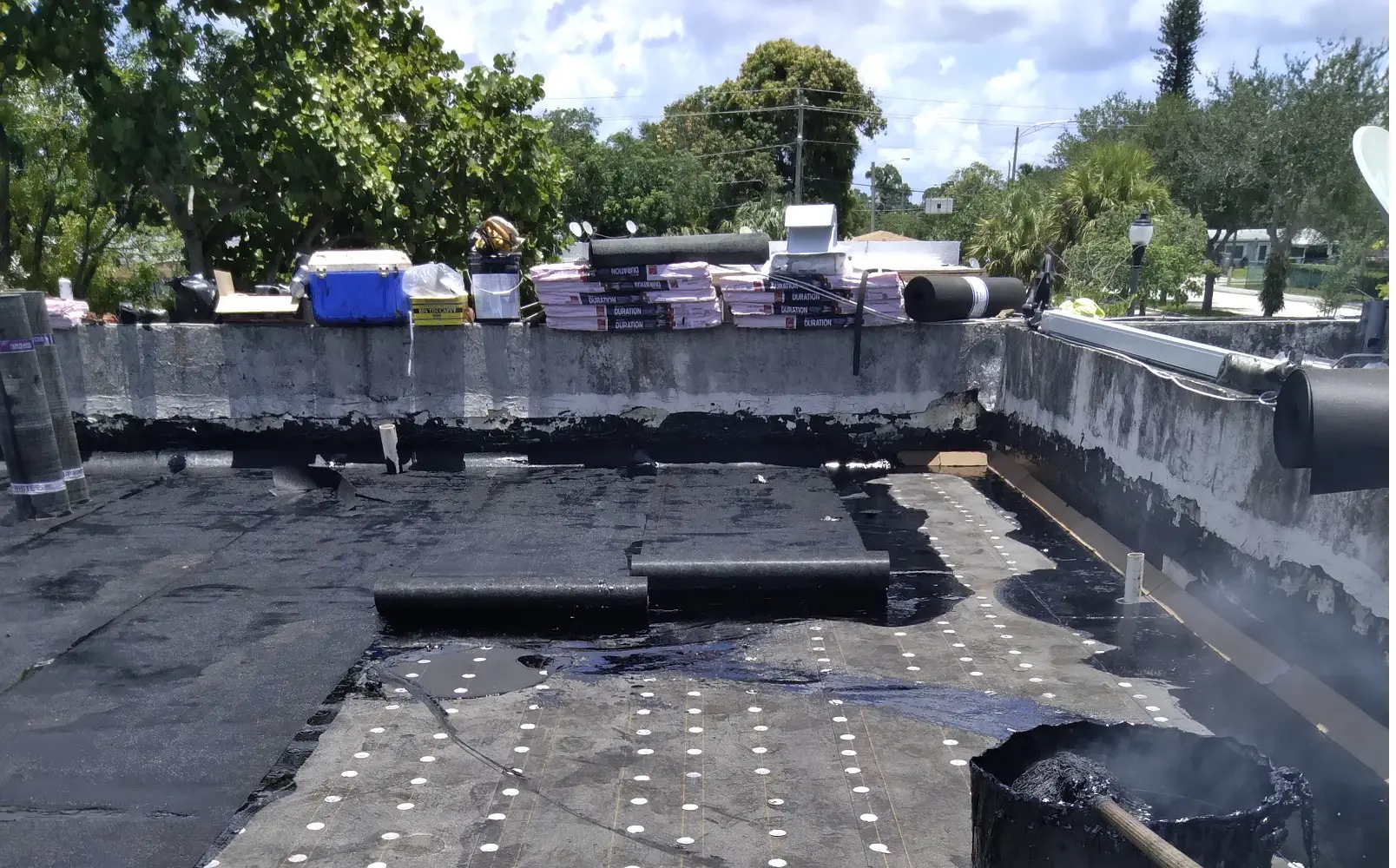 Authentic full-surface concrete deck resurfacing and hot-mop waterproofing