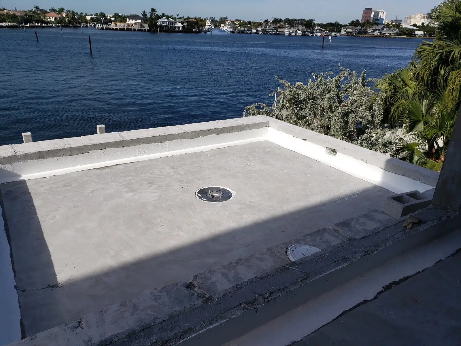 Authentic waterfront elevated concrete slab restoration overlooking coastal waterway