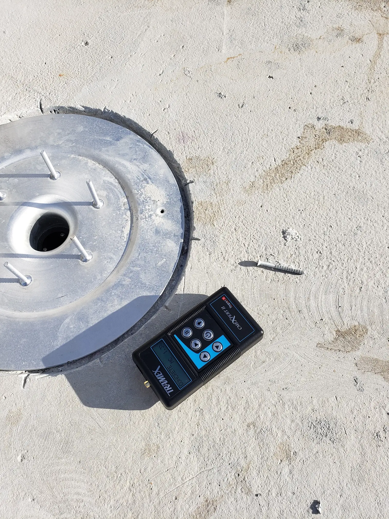 Authentic client Tramex digital moisture testing directly on structural concrete deck